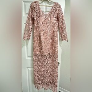 Used once. short dress underneath up to Knee level. Long dress over it.